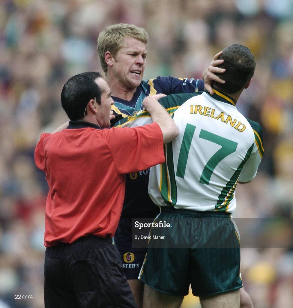 5 November 2006; Ryan O'Keefe, Australia, confronts Sean Martin Lockhart, Ireland, as referee David Coldrick steps in. Coca-Cola International Rules Series 2006, Second Test, Ireland v Australia, Croke Park, Dublin. Picture credit: David Maher / SPORTSFILE