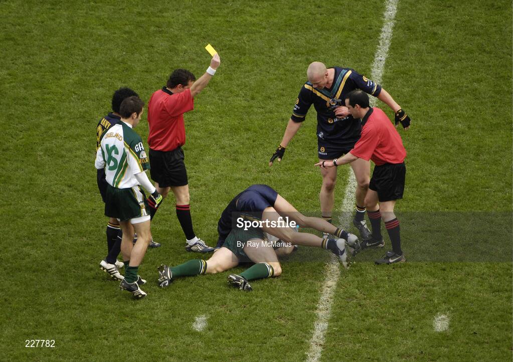5 November 2006; Australian referee Shane McInerney, left, stands over Brett Peake, Australia, and Kieran McGeeney, Ireland, with a yellow card for each. Coca-Cola International Rules Series 2006, Second Test, Ireland v Australia, Croke Park, Dublin. Picture credit: Ray McManus / SPORTSFILE
