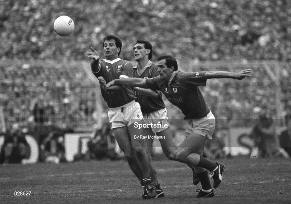 16 September 1990; John O'Driscoll of Cork in action against David Beggy and Gerry McEntee of Meath during the All-Ireland Senior Football Championship Final match between Cork and Meath at Croke Park in Dublin. Photo by Ray McManus/Sportsfile