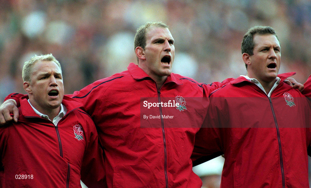 2 October 1999; England players, from left, Neil Back, Lawrence Dallaglio and Richard Hill stand for the national anthem prior to the Rugby World Cup Pool B match between England and Italy at Twickenham Stadium in London, England. Photo by David Maher/Sportsfile