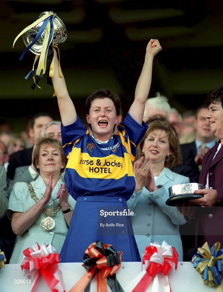 5 September 1999; Meabh Stokes of Tipperary lifts the cup following the Bórd na Gaeilge All-Ireland Senior Camogie Championship Final between Tipperary and Kilkenny at Croke Park in Dublin. Photo by Aoife Rice/Sportsfile