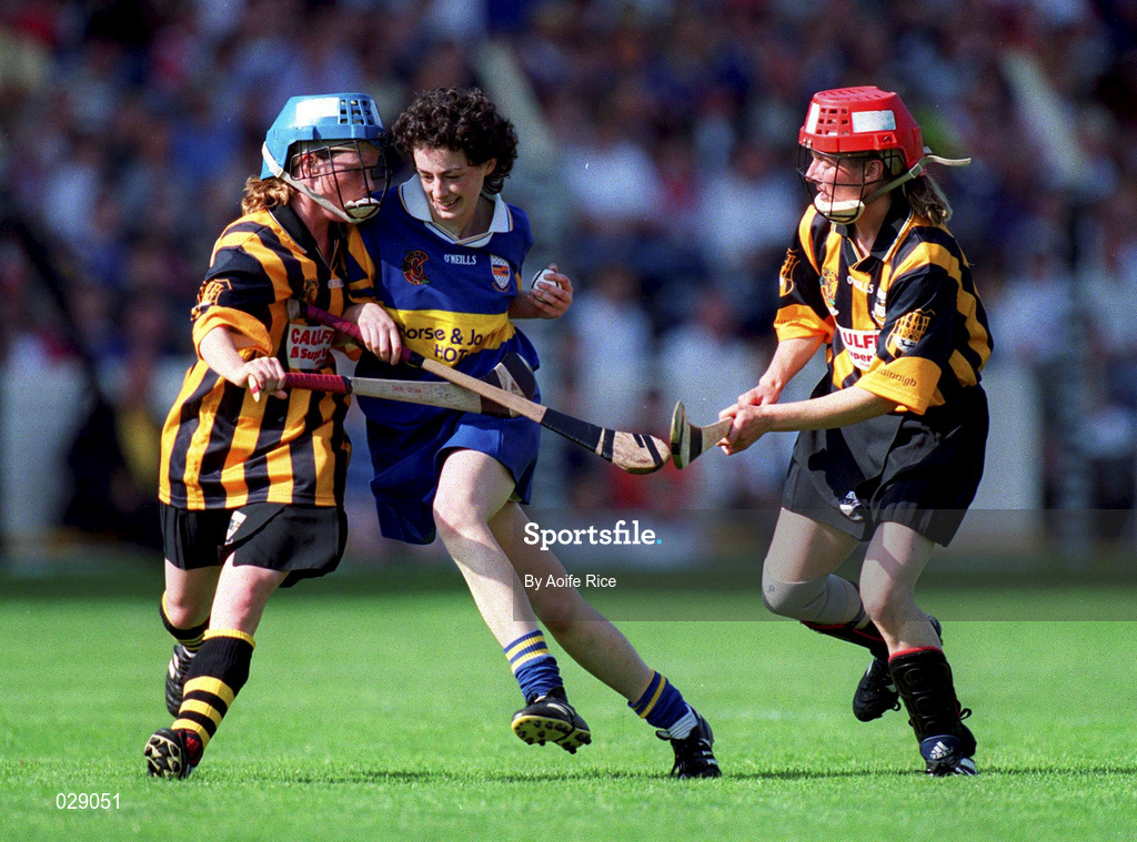 5 September 1999; Noelle Kennedy of Tipperary in action against Sandra Gleeson, left, Jillian Maher of Kilkenny during the Bórd na Gaeilge All-Ireland Senior Camogie Championship Final between Tipperary and Kilkenny at Croke Park in Dublin. Photo by Aoife Rice/Sportsfile