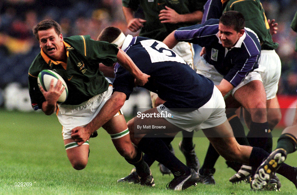 3 October 1999; Robbie Fleck of South Africa is tackled by Stuart Grimes and Scott Murray, right, of Scotland during the Rugby World Cup Pool A match between Scotland and South Africa at Murrayfield Stadium in Edinburgh, Scotland. Photo by Matt Browne/Sportsfile