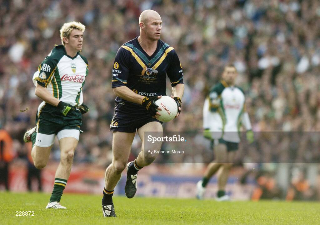 5 November 2006; Barry Hall, Australia, races ahead of Colm Begley, Ireland. Coca-Cola International Rules Series 2006, Second Test, Ireland v Australia, Croke Park, Dublin. Picture credit: Brendan Moran / SPORTSFILE