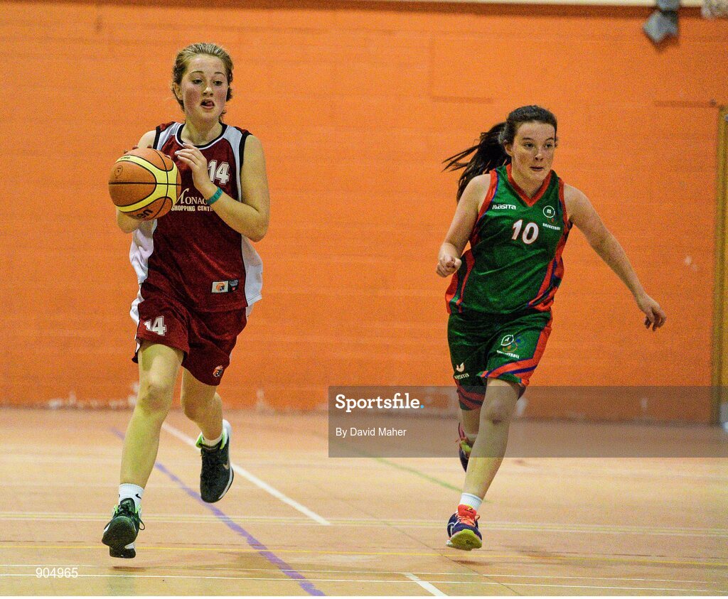 24 August 2014; Alex Mulligan, left, Donagh, Co.Monaghan, representing Ulster, in action against Tara Gunning, Milltown/Emper/Moyvore, Co.Westmeath, representing Leinster,  in the playhoff of the Basketball Girls Under 13. HSE Community Games August Festival 2014, Athlone Institute of Technology, Athlone, Co. Westmeath.  Picture credit: David Maher / SPORTSFILE