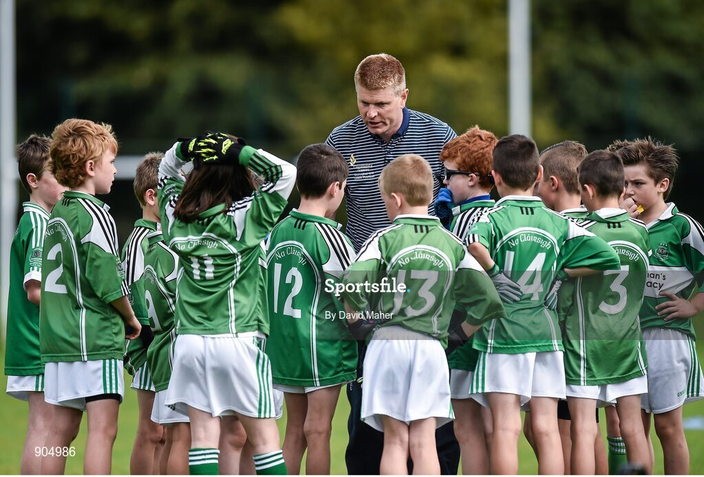 24 August 2014; Coach Martin Sheridan with players from, Monaghan Town, Co.Monaghan, representing Ulster before the start of the Gaellc football Mixed Under 10 playoff final against Clane/Rathcoffey, Co.Kildare, representing Leinster. HSE Community Games August Festival 2014, Athlone Institute of Technology, Athlone, Co. Westmeath.  Picture credit: David Maher / SPORTSFILE