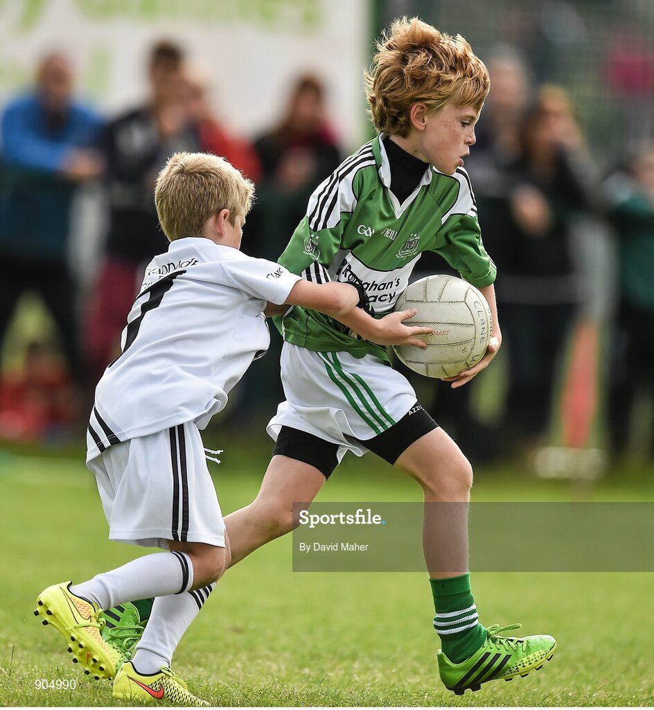 24 August 2014; Michael McMorrow, Monaghan Town, Co.Monaghan, representing Ulster in the Gaellc football Mixed Under10 playoff final against Andrew Hyland, Clane/Rathcoffey, Co.Kildare, representing Leinster. HSE Community Games August Festival 2014, Athlone Institute of Technology, Athlone, Co. Westmeath.  Picture credit: David Maher / SPORTSFILE