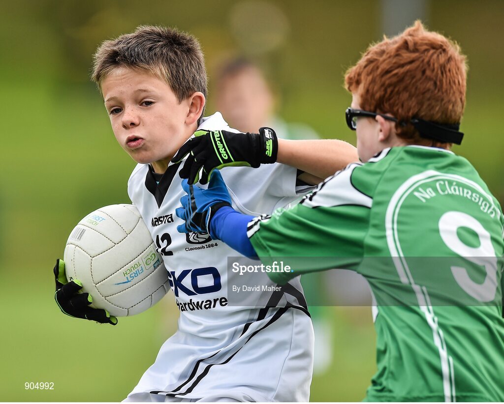 24 August 2014; Sean Shanahan, left, Clane/Rathcoffey, Co.Kildare, representing Leinster in action against Senan Cudden, Monaghan Town, Co.Monaghan, representing Ulster, in the Gaellc football Mixed Under 10 playoff final. HSE Community Games August Festival 2014, Athlone Institute of Technology, Athlone, Co. Westmeath. Picture credit: David Maher / SPORTSFILE