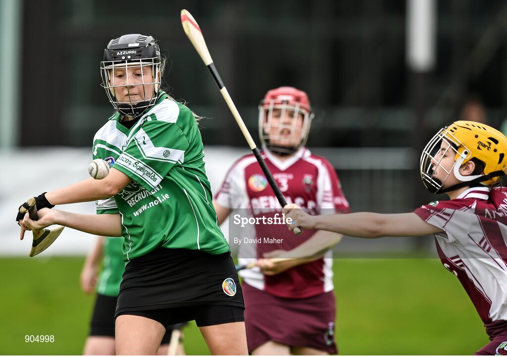 24 August 2014; Caoimhe Morris, left, Lucan, Co.Dublin, representing Leinster, in action against Sarah Curran, Ballyjamesduff, Co.Cavan, representing Ulster in the playoff of the Under 14 Camogie Final. HSE Community Games August Festival 2014, Athlone Institute of Technology, Athlone, Co. Westmeath.  Picture credit: David Maher / SPORTSFILE