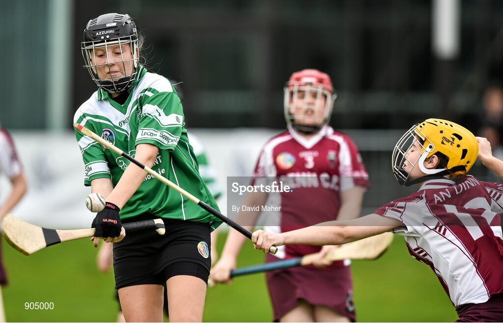 24 August 2014; Caoimhe Morris, left, Lucan, Co.Dublin, representing Leinster, in action against Sarah Curran, Ballyjamesduff, Co.Cavan, representing Ulster in the playoff of the Under 14 Camogie Final. HSE Community Games August Festival 2014, Athlone Institute of Technology, Athlone, Co. Westmeath.  Picture credit: David Maher / SPORTSFILE