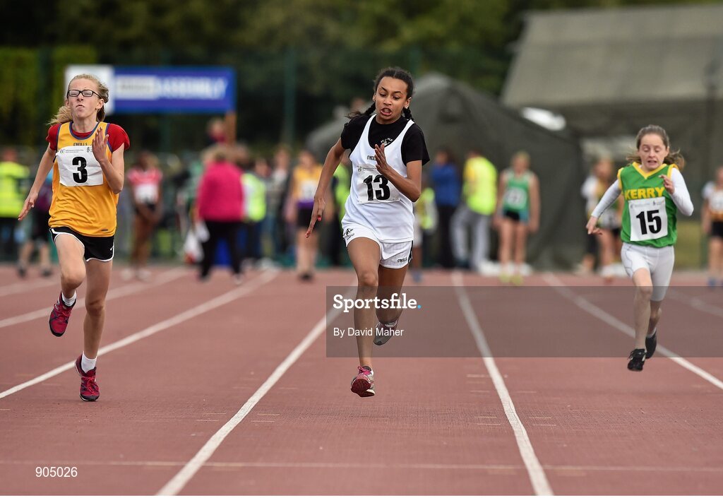24 August 2014; Omason Ayvoro, St.Conleths, Co.Kildare, centre, with Ailbhe Doherty, left, Ennis St.Johns, Co.Clare and Aoife Horgan, Listowel, Co.Kerry, in action during the semi Final of the Girls U.12 100metres. HSE Community Games August Festival 2014, Athlone Institute of Technology, Athlone, Co. Westmeath.  Picture credit: David Maher / SPORTSFILE