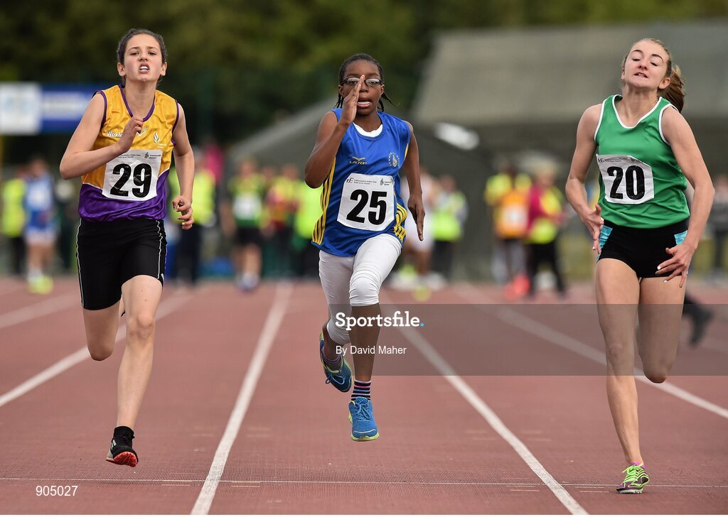 24 August 2014; Yemi Talabi, Mostrim, Co.Longford, centre, with Sabia Doyle, Clonard, Co.Wexford, left, and Holly Meredith, Newcastle West, Co.Limerick, in action  during the semi Final of the Girls U.12 100metres. HSE Community Games August Festival 2014, Athlone Institute of Technology, Athlone, Co. Westmeath.  Picture credit: David Maher / SPORTSFILE
