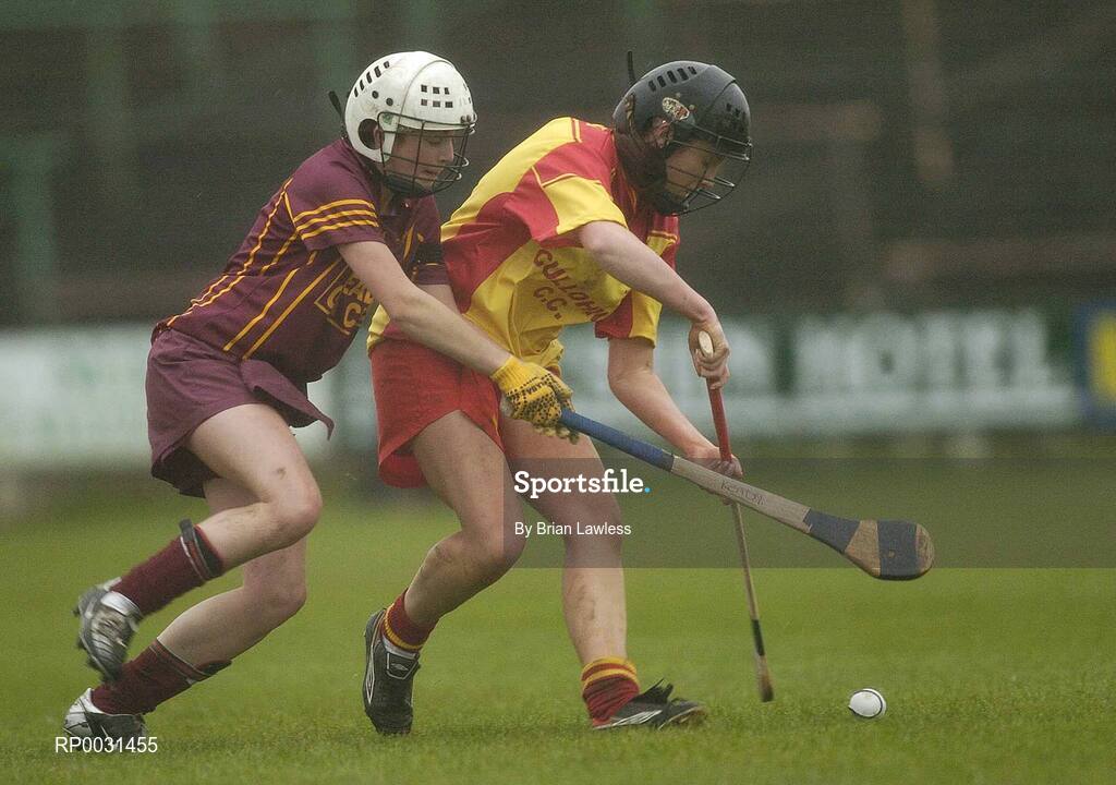 19 November 2006; Erinne Dunne, Harps, in action against Roisin Murray, Keady. All-Ireland Junior Camogie Championship Final, Harps v Keady, O'Moore Park, Portlaoise, Co. Laois. Picture credit: Brian Lawless / SPORTSFILE