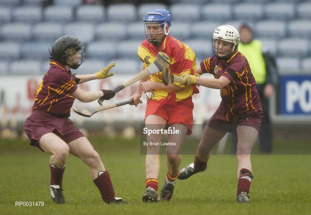 19 November 2006; Elaine Mahony, Harps, in action against Patricia McCabe, left, and Roisin Murray, Keady. All-Ireland Junior Camogie Championship Final, Harps v Keady, O'Moore Park, Portlaoise, Co. Laois. Picture credit: Brian Lawless / SPORTSFILE