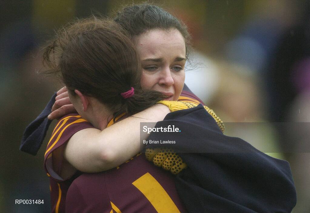 19 November 2006; Keady team-mates Danielle McBirney, left, and captain Michelle Murray console each other after the match. All-Ireland Junior Camogie Championship Final, Harps v Keady, O'Moore Park, Portlaoise, Co. Laois. Picture credit: Brian Lawless / SPORTSFILE
