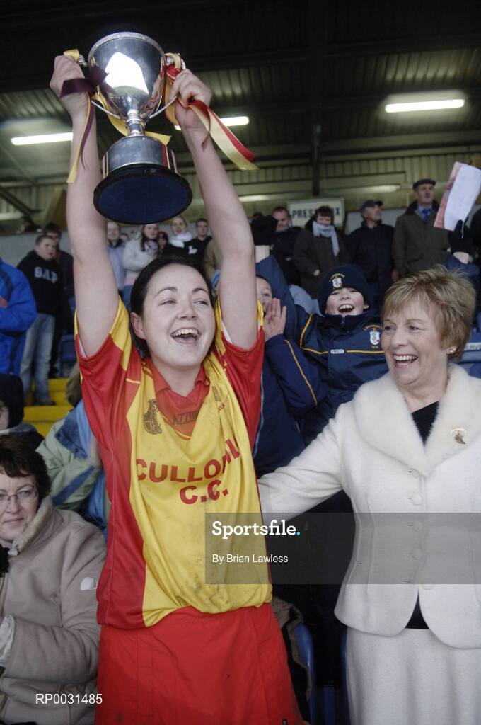 19 November 2006; Harps captain Denise Quigley lifts the McBride cup, in the company of Liz Howard, President, Cumann Camogaiochta na nGael. All-Ireland Junior Camogie Championship Final, Harps v Keady, O'Moore Park, Portlaoise, Co. Laois. Picture credit: Brian Lawless / SPORTSFILE
