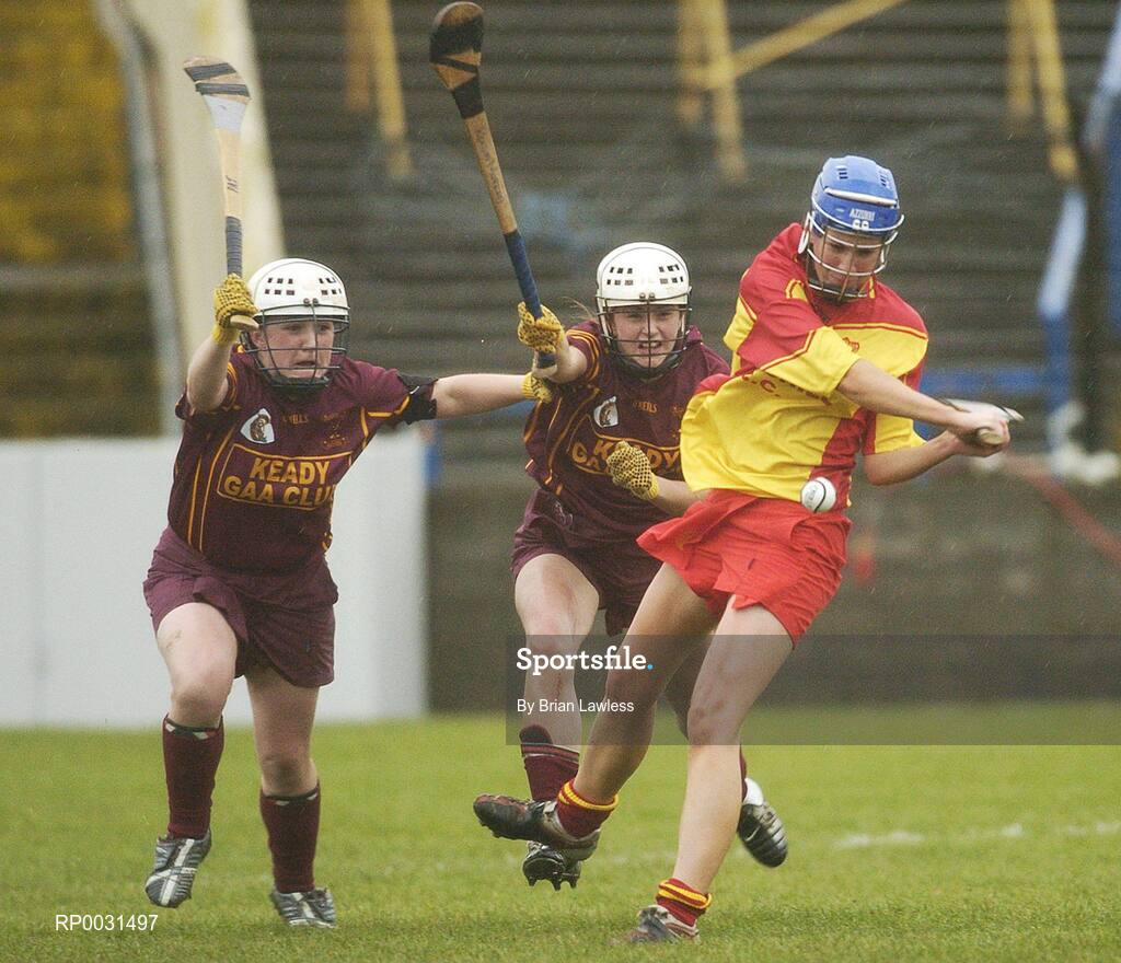 19 November 2006; Elaine Mahony, Harps, in action against Patricia Murphy, left, and Roisin Murray, Keady. All-Ireland Junior Camogie Championship Final, Harps v Keady, O'Moore Park, Portlaoise, Co. Laois. Picture credit: Brian Lawless / SPORTSFILE