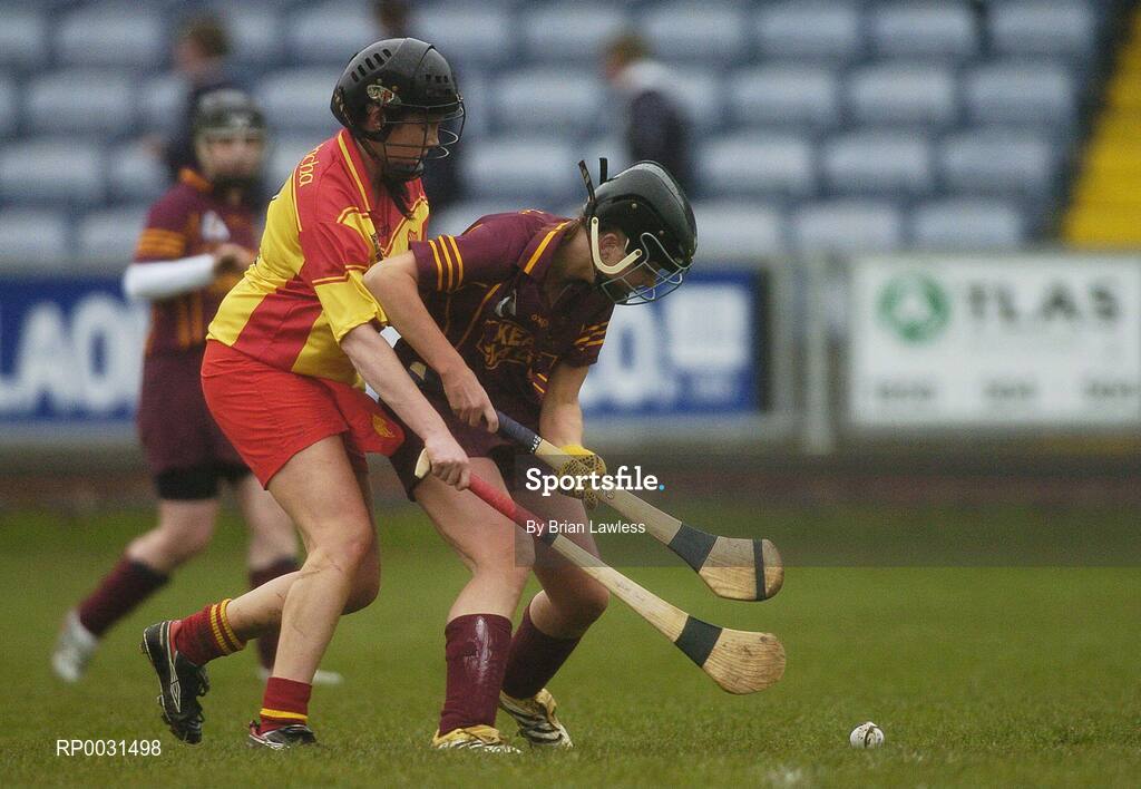 19 November 2006; Katrina Kinsella, Keady, in action against Erinne Dunne, Harps. All-Ireland Junior Camogie Championship Final, Harps v Keady, O'Moore Park, Portlaoise, Co. Laois. Picture credit: Brian Lawless / SPORTSFILE