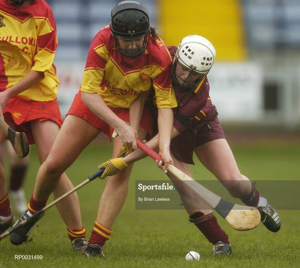 19 November 2006; Erinne Dunne, Harps, in action against Roisin Murray, Keady. All-Ireland Junior Camogie Championship Final, Harps v Keady, O'Moore Park, Portlaoise, Co. Laois. Picture credit: Brian Lawless / SPORTSFILE