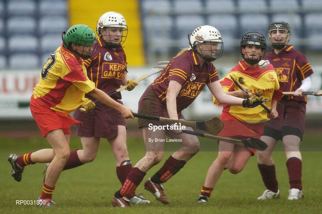 19 November 2006; Helena Murray, Keady, in action against Angela Hanlon, left, and Elaine Cuddy, Harps. All-Ireland Junior Camogie Championship Final, Harps v Keady, O'Moore Park, Portlaoise, Co. Laois. Picture credit: Brian Lawless / SPORTSFILE