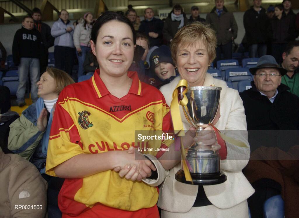 19 November 2006; Harps captain Denise Quigley is presented with the McBride cup by Liz Howard, President, Cumann Camogaiochta na nGael. All-Ireland Junior Camogie Championship Final, Harps v Keady, O'Moore Park, Portlaoise, Co. Laois. Picture credit: Brian Lawless / SPORTSFILE