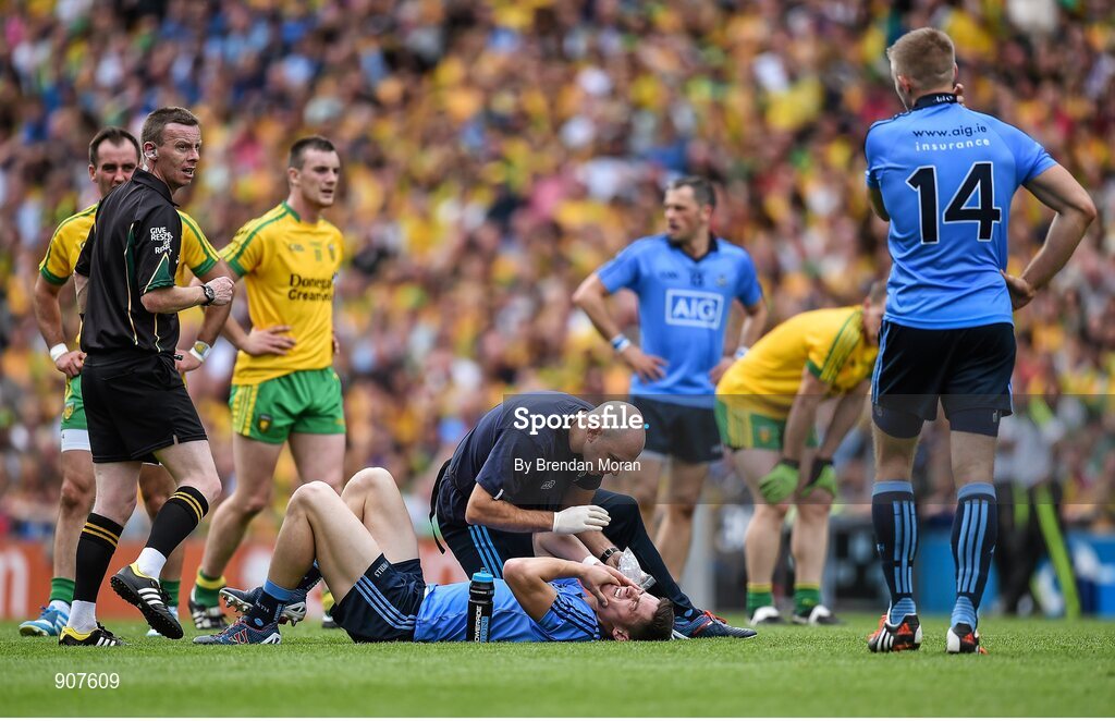 31 August 2014; Diarmuid Connolly, Dublin, is attended to by medical personell during the first half. GAA Football All Ireland Senior Championship, Semi-Final, Dublin v Donegal, Croke Park, Dublin. Picture credit: Brendan Moran / SPORTSFILE