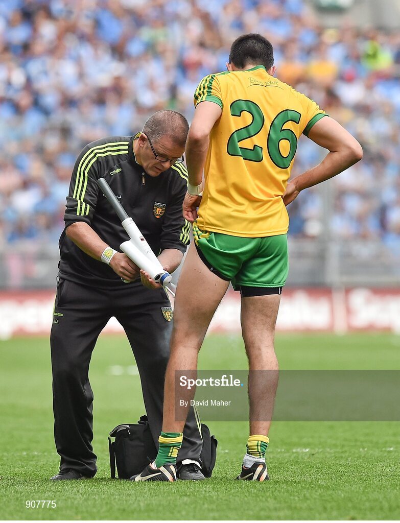 31 August 2014; JD McGearnry, Donegal backroom staff, attends to Rory Kavanagh, during the game. GAA Football All Ireland Senior Championship, Semi-Final, Dublin v Donegal, Croke Park, Dublin. Picture credit: David Maher / SPORTSFILE