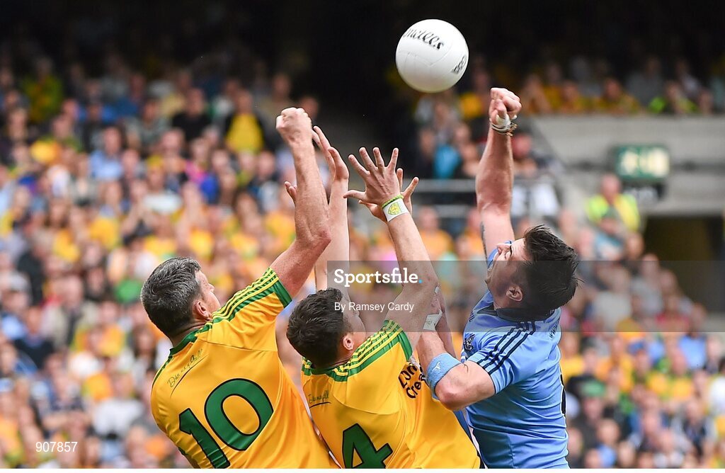31 August 2014; Michael Darragh Macauley, Dublin, in action against Christy Toye, left, and Paddy McGrath, Donegal. GAA Football All Ireland Senior Championship, Semi-Final, Dublin v Donegal, Croke Park, Dublin. Picture credit: Ramsey Cardy / SPORTSFILE