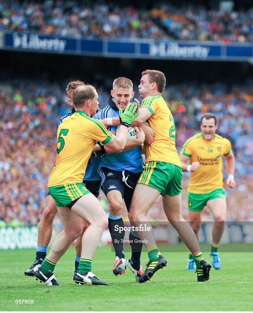 31 August 2014; Eoghan O'Gara and Jonny Cooper, hidden, Dublin, in action against Anthony Thompson, left, and Eamonn McGee, Donegal. GAA Football All Ireland Senior Championship, Semi-Final, Dublin v Donegal, Croke Park, Dublin. Picture credit: Tomas Greally / SPORTSFILE