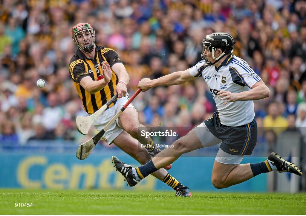 7 September 2014; Tipperary goalkeeper Darren Gleeson clears under pressure from Eoin Larkin, Kilkenny. GAA Hurling All Ireland Senior Championship Final, Kilkenny v Tipperary. Croke Park, Dublin. Picture credit: Ray McManus / SPORTSFILE