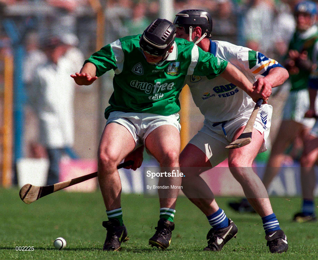 25 May 1997; Barry Foley of Limerick in action against Sean Cullinane of Waterford during the Munster Senior Hurling Championship Quarter-Final between Limerick and Waterford at Semple Stadium in Thurles, Co. Tipperary. Photo by Brendan Moran/Sportsfile