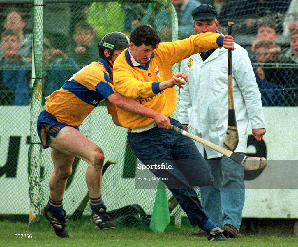 10 May 1997; Brendan Cummins of Tipperary is pressured by Niall Gilligan of Clare during the National Hurling League Division 1 match between Clare and Tipperary at Cusack Park in Ennis. Photo by Ray McManus/Sportsfile