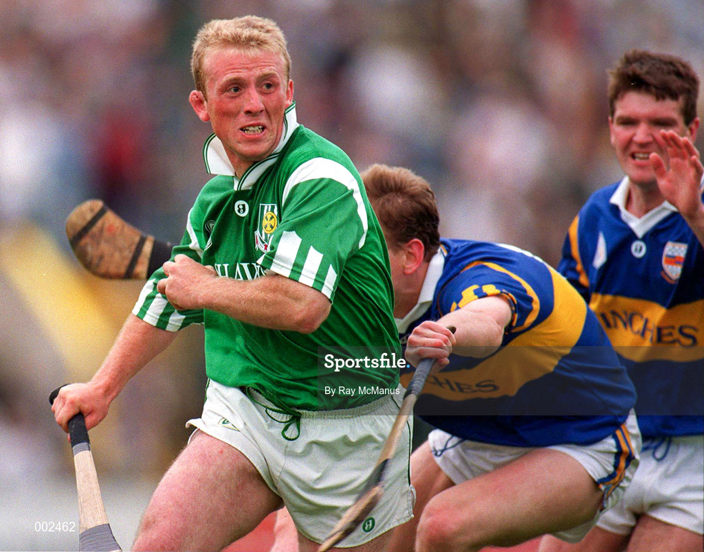 18 June 1995; Dave Clarke of Limerick gets past the challenge of Anthony Crosse and Michael Cleary of Tipperary during the Munster Senior Hurling Championship Semi-Final between Limerick and Tipperary at Páirc Uí Chaoimh, Cork. Photo by Ray McManus/Sportsfile