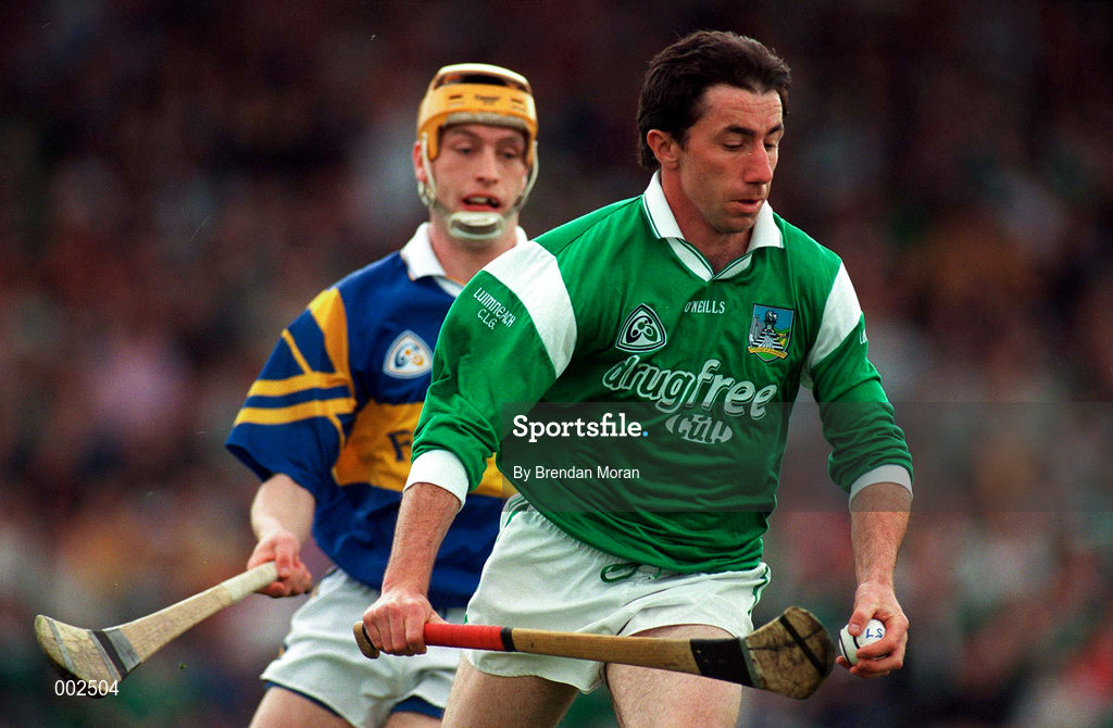 13 April 1997; Declan Nash of Limerick in action against Liam Cahill of Tipperary during the National Hurling League Division 1 match between Limerick v Tipperary at the Gaelic Grounds in Limerick. Photo by Brendan Moran/Sportsfile
