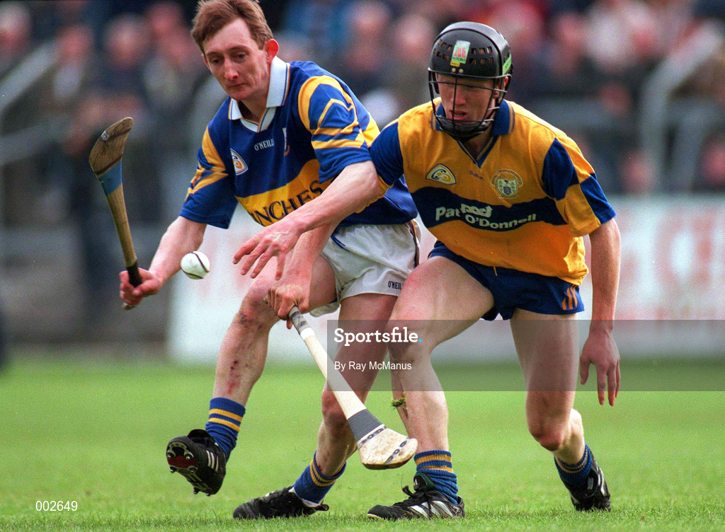 10 May 1997; George Frend of Tipperary in action against Niall Gilligan of Clare during the National Hurling League Division 1 match between Clare and Tipperary at Cusack Park in Ennis. Photo by Ray McManus/Sportsfile