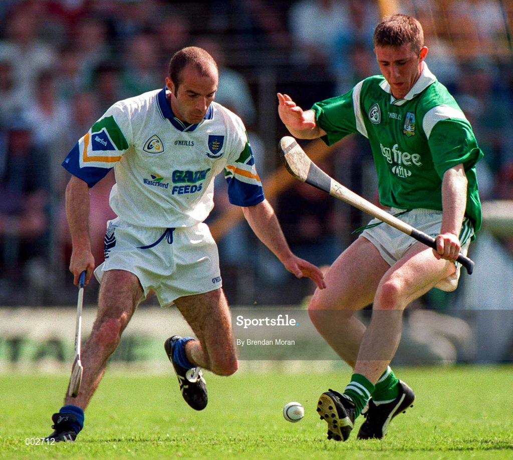 25 May 1997; James Moran of Limerick in action against Mark O'Sullivan of Waterford during the Munster Senior Hurling Championship Quarter-Final between Limerick and Waterford at Semple Stadium in Thurles, Co. Tipperary. Photo by Brendan Moran/Sportsfile