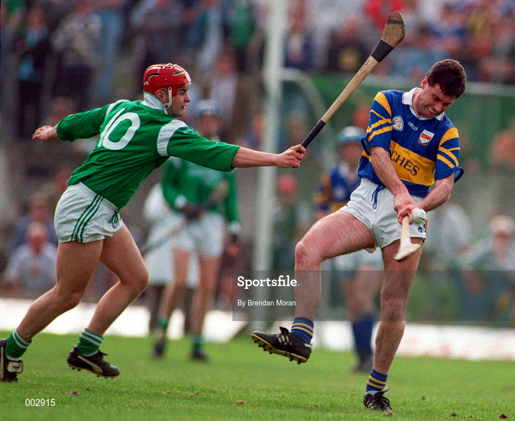 13 April 1997; Kevin Tucker of Tipperary in action against TJ Ryan of Limerick during the National Hurling League Division 1 match between Limerick v Tipperary at the Gaelic Grounds in Limerick. Photo by Brendan Moran/Sportsfile