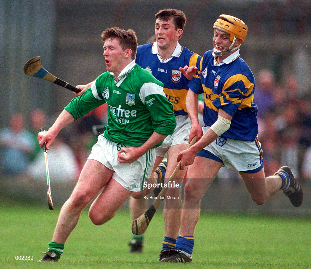 13 April 1997; Mark Foley of Limerick in action against Kevin Tucker and Liam Cahill of Tipperary during the National Hurling League Division 1 match between Limerick v Tipperary at the Gaelic Grounds in Limerick. Photo by Brendan Moran/Sportsfile