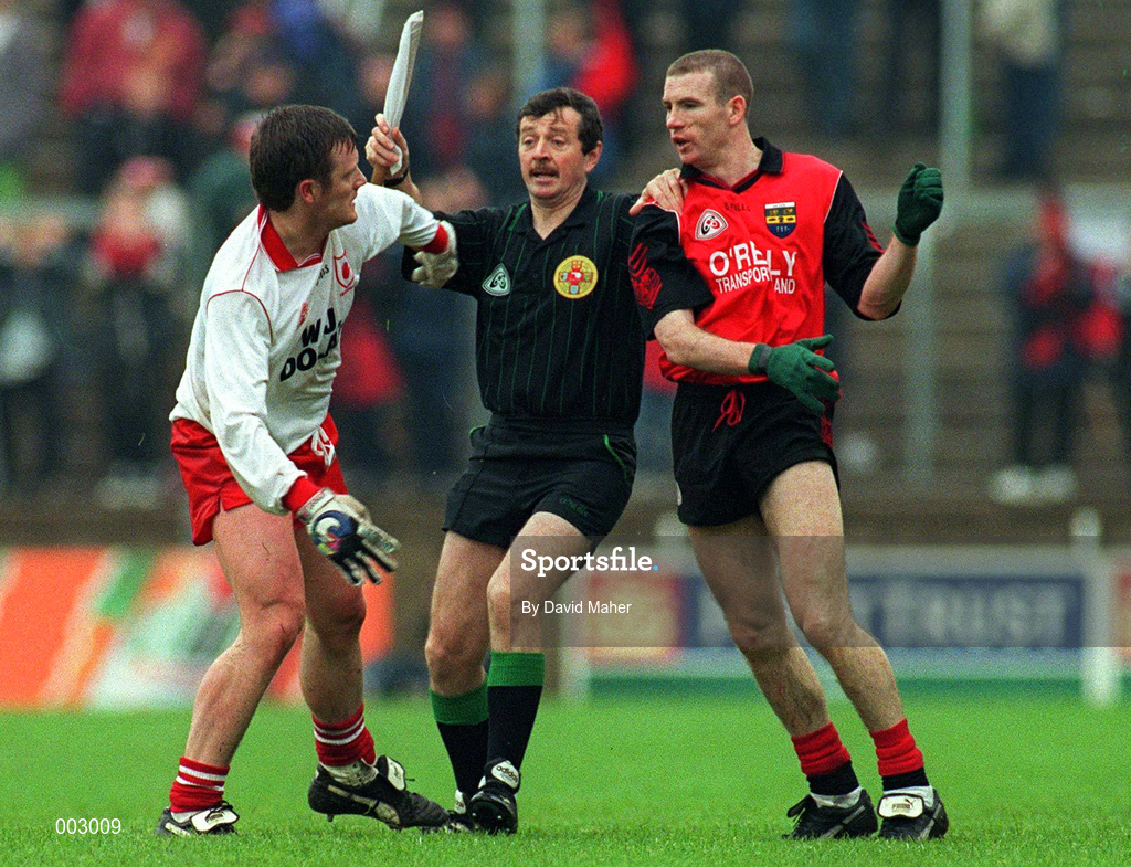 18 May 1997; Linesman Martin McBrien separates Seamus McCallen of Tyrone and Ross Carr of Down during the Ulster GAA Football Senior Championship Preliminary Round match between Down and Tyrone at St. Tiernach's Park in Clones. Photo by David Maher/Sportsfile