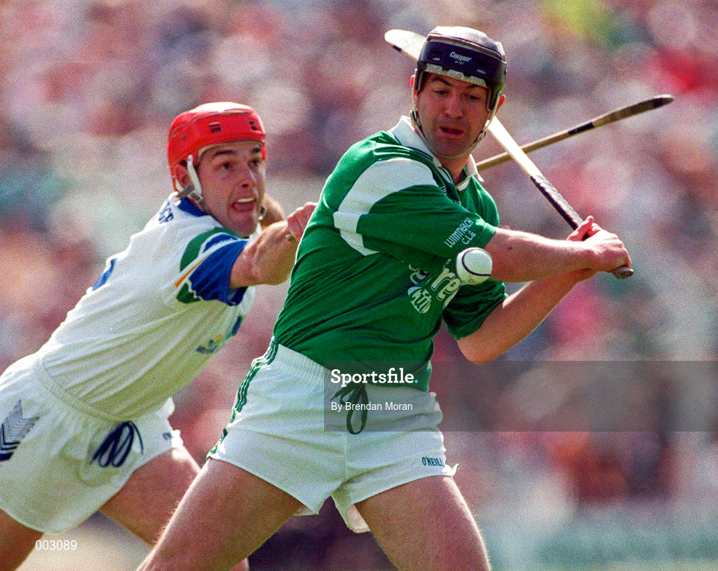 25 May 1997; Mike Galligan of Limerick in action against Stephen Frampton of Waterford during the Munster Senior Hurling Championship Quarter-Final between Limerick and Waterford at Semple Stadium in Thurles, Co. Tipperary. Photo by Brendan Moran/Sportsfile