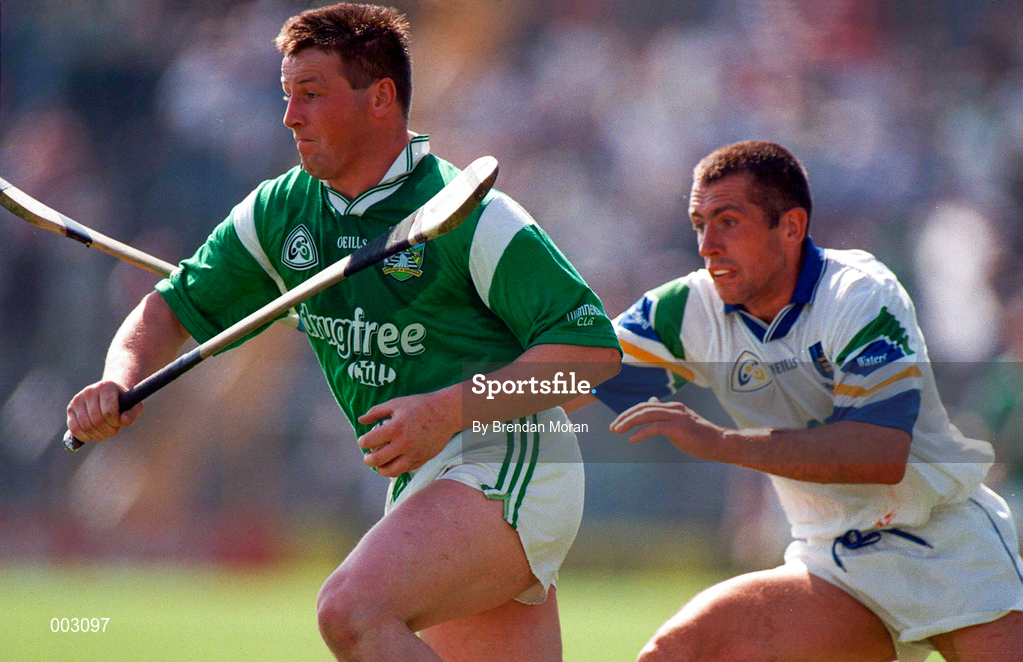 25 May 1997; Mike Houlihan of Limerick in action against Peter Queally of Waterford during the Munster Senior Hurling Championship Quarter-Final between Limerick and Waterford at Semple Stadium in Thurles, Co. Tipperary. Photo by Brendan Moran/Sportsfile