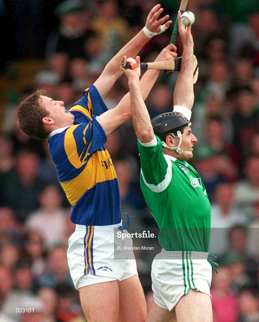 13 April 1997; Mike Nash of Limerick in action against Brian O'Mera of Tipperary during the National Hurling League Division 1 match between Limerick v Tipperary at the Gaelic Grounds in Limerick. Photo by Brendan Moran/Sportsfile
