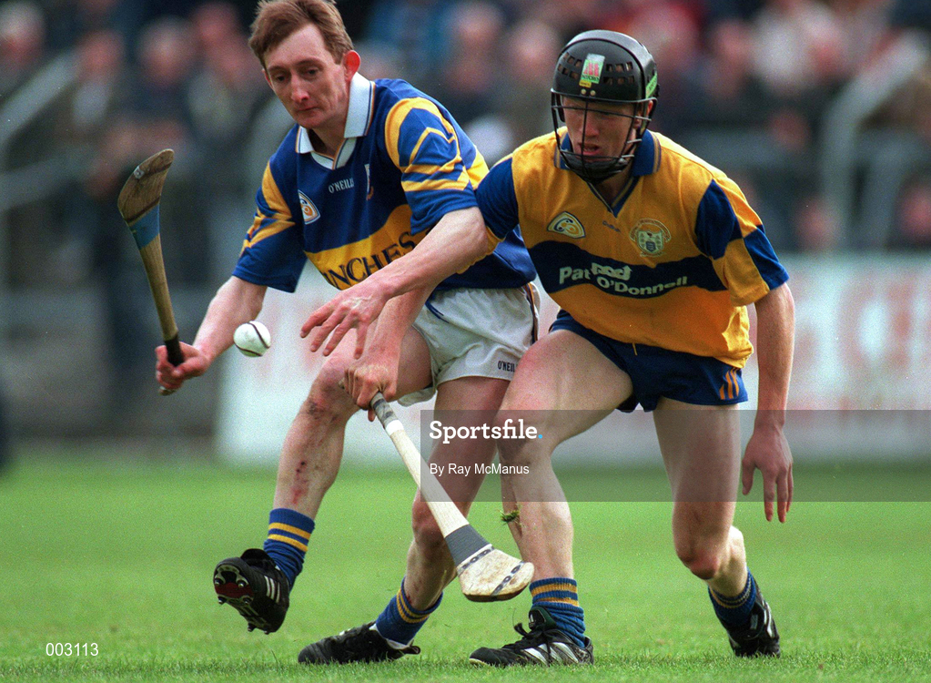 10 May 1997; Niall Gilligan of Clare in action against George Frend of Tipperary during the National Hurling League Division 1 match between Clare and Tipperary at Cusack Park in Ennis. Photo by Ray McManus/Sportsfile