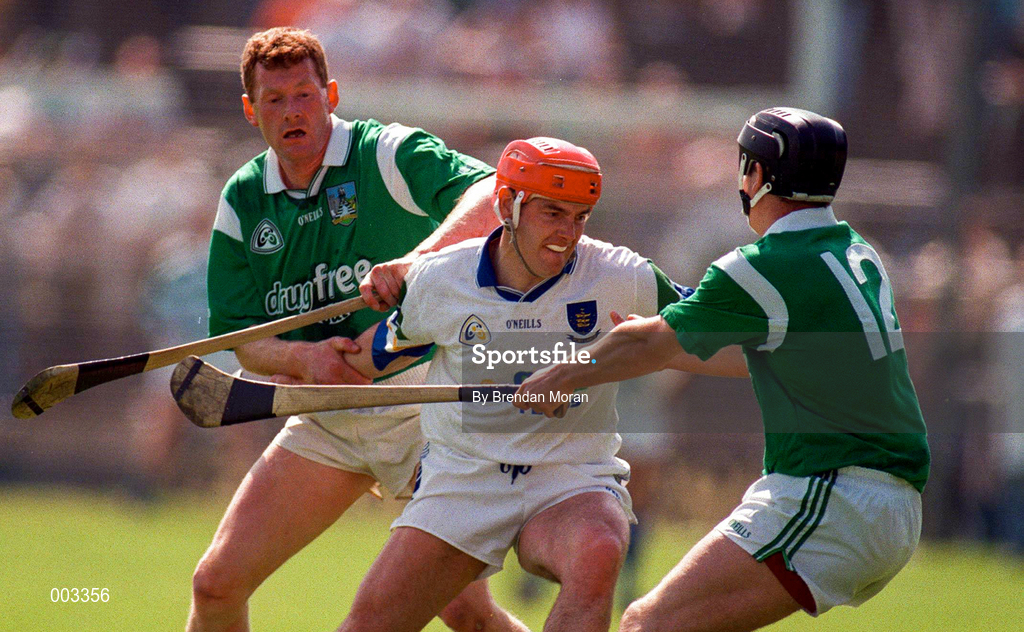 25 May 1997; Stephen Frampton of Waterford in action against Sean O'Neill and Harry Foley of Limerick during the Munster Senior Hurling Championship Quarter-Final between Limerick and Waterford at Semple Stadium in Thurles, Co. Tipperary. Photo by Brendan Moran/Sportsfile