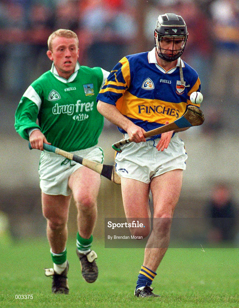13 April 1997; Thomas Dunne of Tipperary in action against Dave Clarke of Limerick during the National Hurling League Division 1 match between Limerick v Tipperary at the Gaelic Grounds in Limerick. Photo by Brendan Moran/Sportsfile