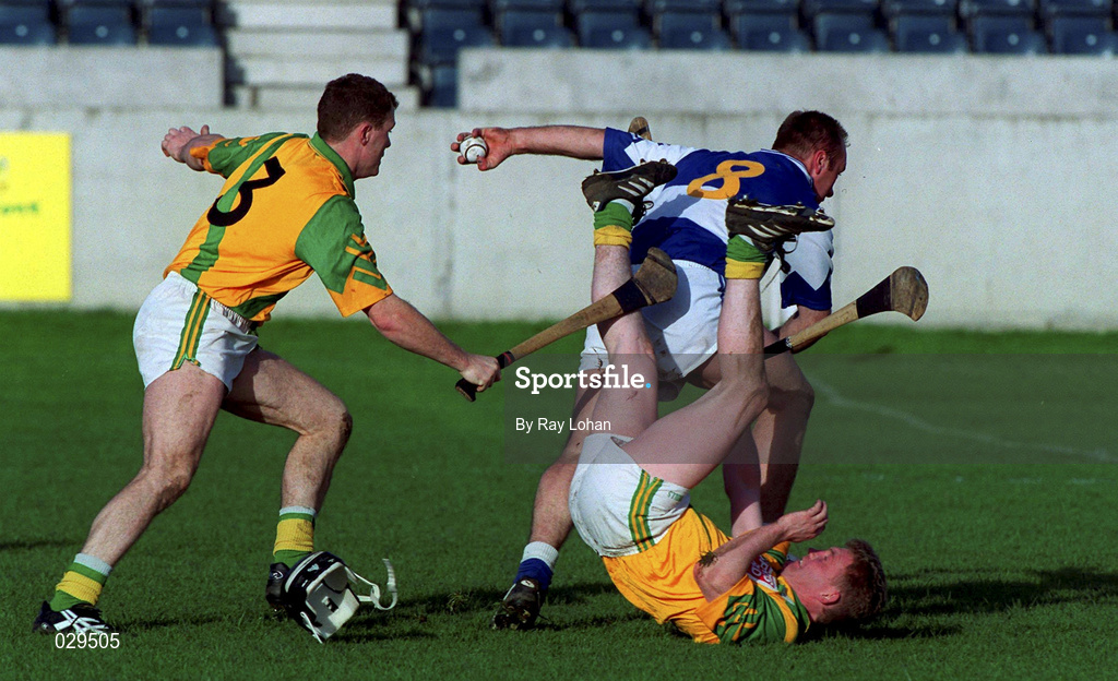 30 October 1999; David Cuddy of Castletown gets past Liam Walsh, left, and Ruari Boland of Faughs during the AIB Leinster Club Hurling Championship Quarter-Final match between Castletown, Laois, and Faughs, Dublin, at Parnell Park in Dublin. Photo by Ray Lohan/Sportsfile
