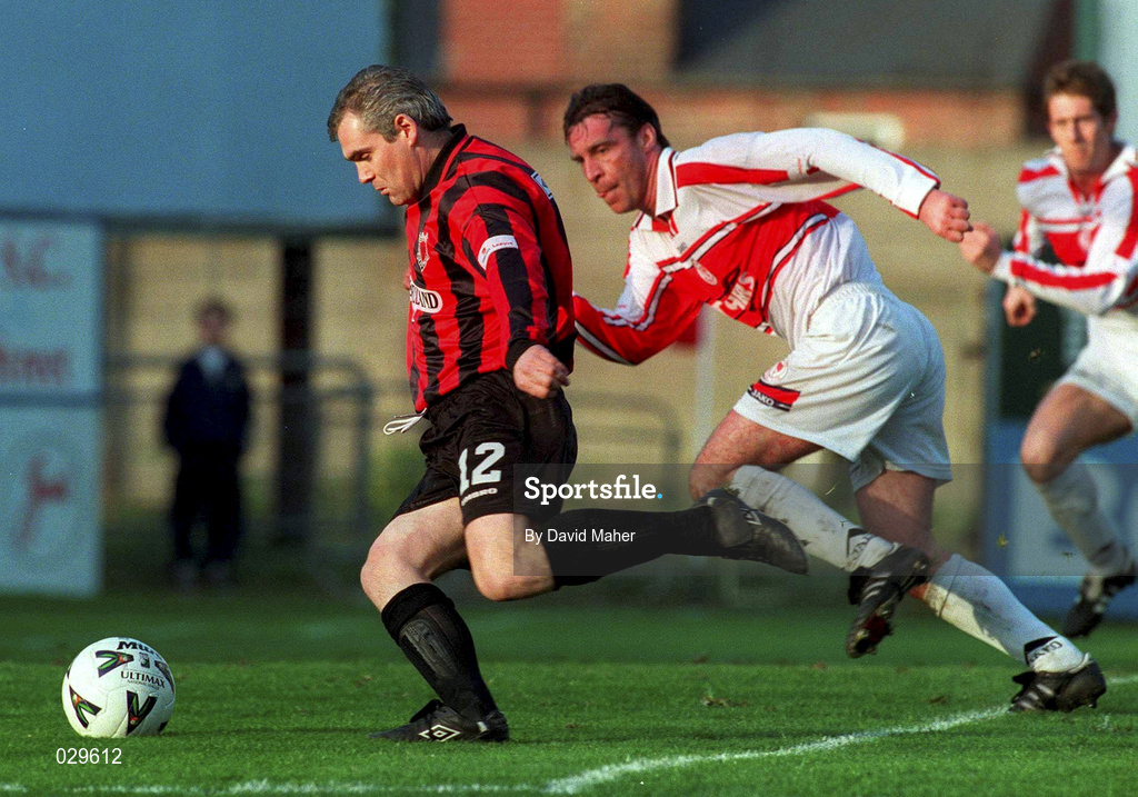 31 October 1999; Derek Swan of Bohemians shoots to socre his side's second goal despite the attention of Ian Lynch of Sligo Rovers during the Eircom League Premier Division match between Bohemians and Sligo Rovers at Dalymount Park in Dublin. Photo by David Maher/Sportsfile