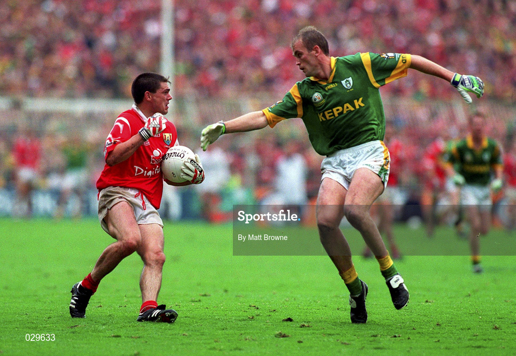 26 September 1999; Don Davis of Cork in action against John McDermott of Meath during the Bank of Ireland All-Ireland Senior Football Championship Final match between Meath and Cork at Croke Park in Dublin. Photo by Matt Browne/Sportsfile