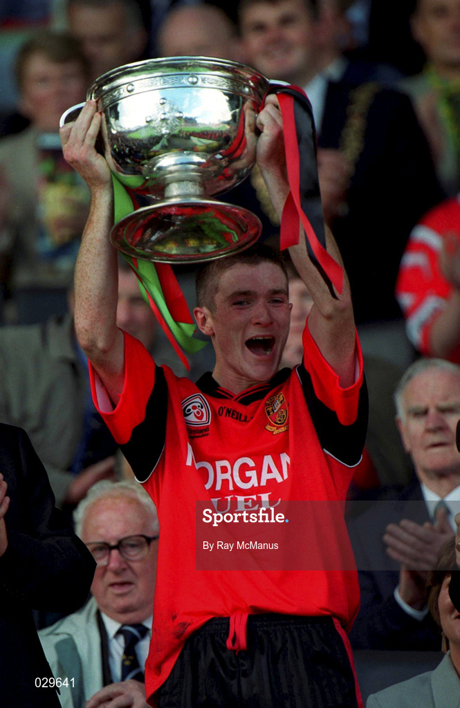 26 September 1999; Down captain Liam Doyle lifts the Tom Markham Cup following the All-Ireland Minor Football Championship Final between Down and Mayo at Croke Park in Dublin. Photo by Ray McManus/Sportsfile
