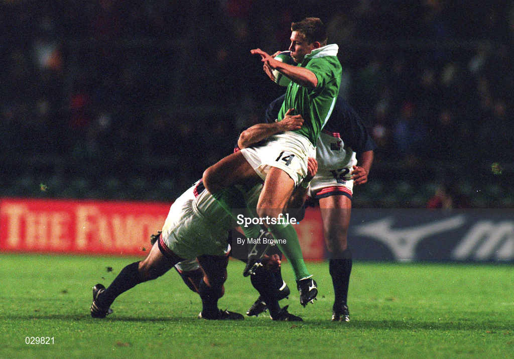 2 October 1999; Justin Bishop of Ireland is tackled by Richard Tardits and Tomasi Takau, right, of USA during the Rugby World Cup Pool E match between Ireland and USA at Lansdowne Road in Dublin. Photo by Matt Browne/Sportsfile